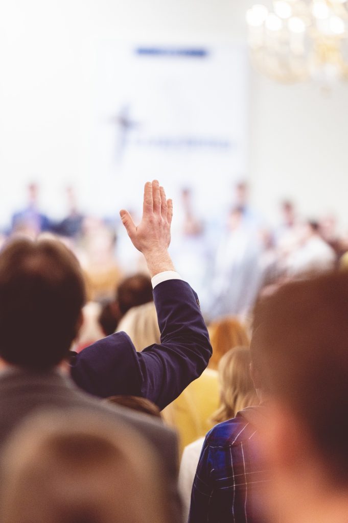 Man raising hand during a congregation in a church